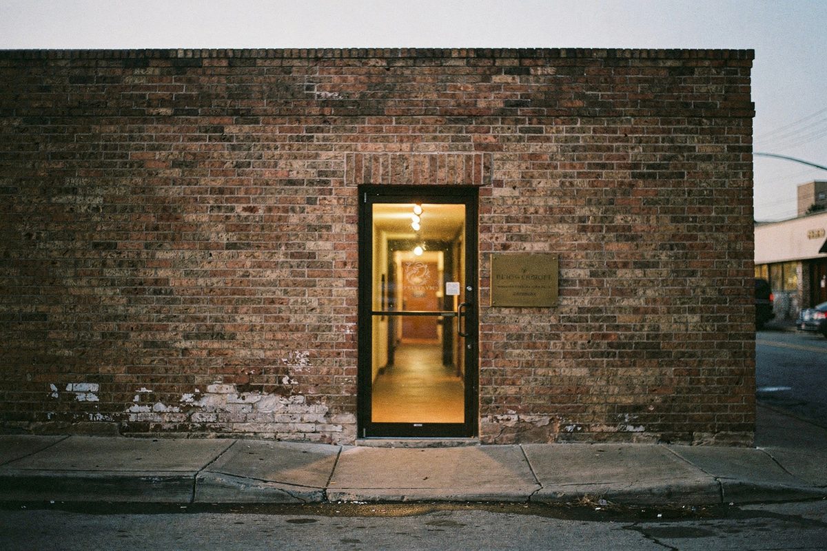 Exterior entrance of the Murevix studio with a small brass nameplate